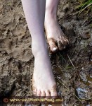 bare feet in mud and rain